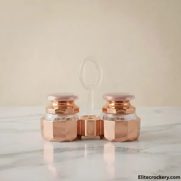 Salt and Pepper Shaker Set in rose gold on marble tabletop