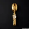 Gold Serving Tongs Flat Flat view of gold floral serving tongs