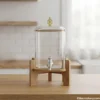Single glass water dispenser with wooden stand and silver tap
