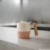 Dual-tone ceramic coffee mug with wooden handle