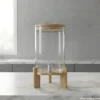 Glass Water Dispenser with Wooden Stand Marble Setup Glass water dispenser with wooden stand on marble table