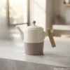 Dual-tone ceramic teapot with wooden handle and knob