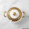 Top view of ceramic soup tureen lid with gold geometric pattern