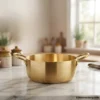 Luxury golden serving pot on marble countertop setup