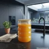 Rippled glass sipper with juice in kitchen