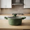 Green Prestige non stick handi pot sitting on kitchen wooden table
