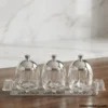 Glass Jar Set with Tray featuring silver lids on wooden table