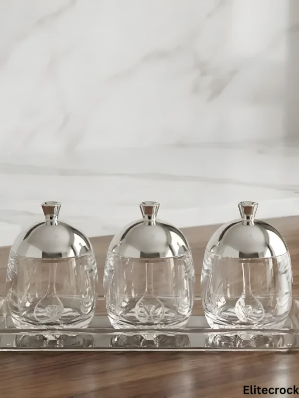 Silver Glass Jar Set Glass Jar Set with Tray featuring silver lids on wooden table