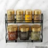 Spice Rack Set with Glass Jars filled with spices on kitchen counter