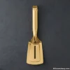 Gold premium serving tongs on dark background