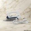 Westpoint Dry Iron WF-2431 with power cord on marble counter