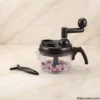 Manual Hand Chopper Onion Prep Manual Hand Chopper filled with chopped onions and peeler