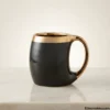 Luxury black ceramic mug with metallic gold lining interior