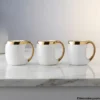 Luxury Gold Trim Ceramic Coffee Mug Set Set of Luxury Gold Trim Ceramic Coffee Mugs on marble counter