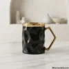 Single luxury black ceramic mug with geometric gold handle