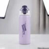 Purple stainless steel sports water bottle front view with secure lock cap