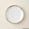 White ceramic saucer with silver rim