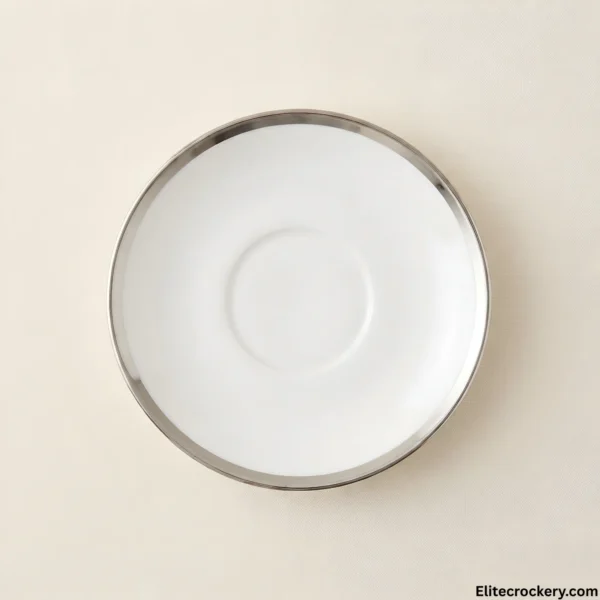 White ceramic saucer with silver rim