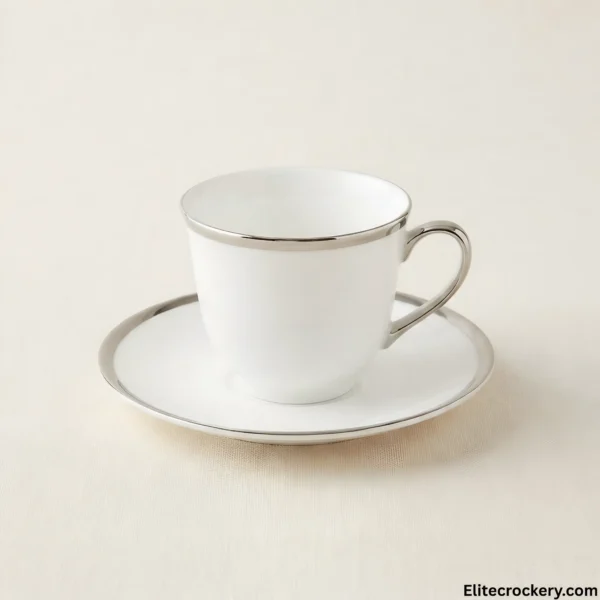 White tea cup and saucer with silver trim