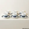 Full collection of six luxury tea cups and saucers arranged together