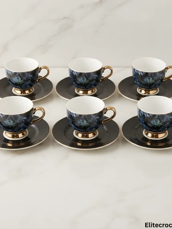 Set of Six Midnight Tropical Leaf Teacups Arrangement of six luxury tea cups and saucers on marble