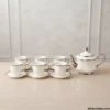 White and silver tea set full display on table