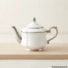 White ceramic teapot with silver trim